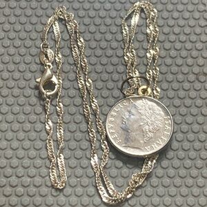 14k gold bale connected to a Italian coin